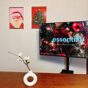 a vase sitting on a table with a tv at Daegu Stay Hoya in Daegu