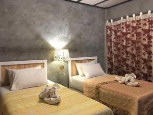 Postel nebo postele na pokoji v ubytování Banter Resort