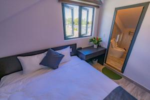 Ένα ή περισσότερα κρεβάτια σε δωμάτιο στο Estella Hotel Dalat