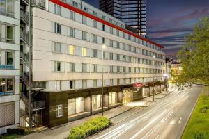 an empty street in front of a building at Ramada by Wyndham Essen in Essen