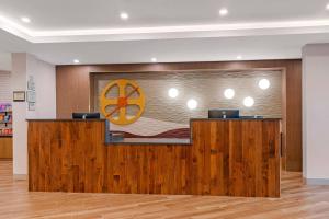 a lobby with a reception desk in a building at Cambria Hotel & Suites Plymouth in Plymouth