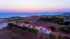an aerial view of a house on the beach at Romanos Beach Villas in Romanu