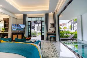 a bedroom with a view of a living room at Siri Villa Chiang Mai in Chiang Mai