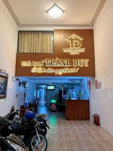 a hotel lobby with motorcycles parked in front of it at Nhà Nghỉ Thành Duy in Quang Ngai