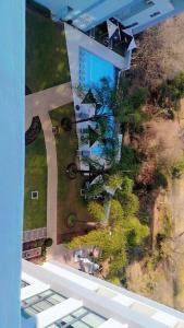 an overhead view of a building with trees in a yard at Cosy Regency menylin apartment in Pretoria