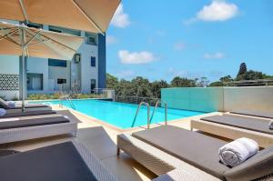 an image of a swimming pool in a house at Cosy Regency menylin apartment in Pretoria