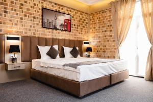 Ένα ή περισσότερα κρεβάτια σε δωμάτιο στο Air Hotel