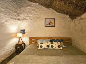 Postel nebo postele na pokoji v ubytování Chaukhamba Cradle