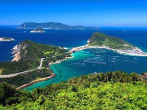 an aerial view of the islands in the ocean at AKISAWA HOTEL in Sukumo
