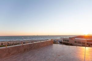 a view of the ocean from the balcony of a building at Ramada by Wyndham Baku in Baku +101 photos