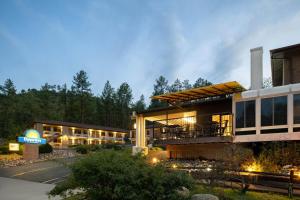 a large building with a restaurant in front of it at Days Inn by Wyndham Prescott in Prescott