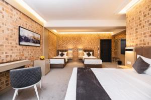 Ένα ή περισσότερα κρεβάτια σε δωμάτιο στο Air Hotel