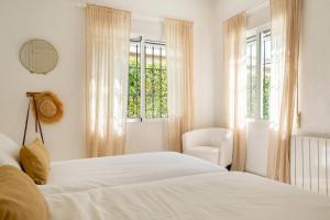 Ένα ή περισσότερα κρεβάτια σε δωμάτιο στο Villa Jardín botánico