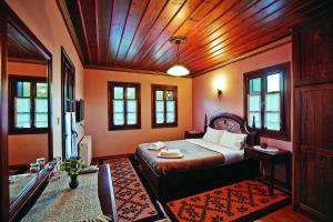 Postel nebo postele na pokoji v ubytování Papigiotis Hotel