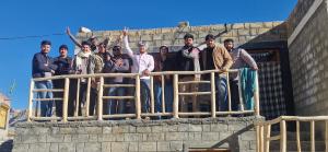 a group of people standing on top of a building at Serenity Stay Rangrik in Kaza +5 photos