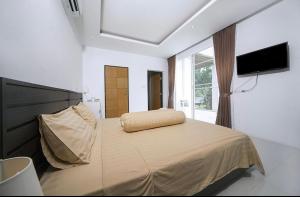 En eller flere senge i et værelse på Villa with private pool in Kamala + 17 billeder