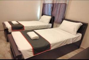 Postel nebo postele na pokoji v ubytování Townhouse Oak Tirupati Formerly Sky Towers