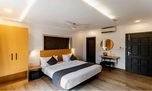 Ένα ή περισσότερα κρεβάτια σε δωμάτιο στο Hotel O Shalimar Railway Station Formerly Samrat Palace