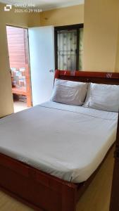 En eller flere senge i et værelse på Roswood Baguio Transient Home