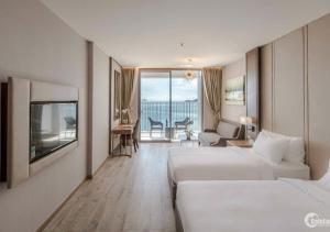 Ένα ή περισσότερα κρεβάτια σε δωμάτιο στο Panorama Nha Trang Sky Beach Residences +54 φωτογραφίες