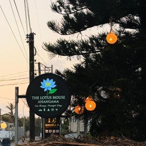 a sign for the lotus house at albuquerque at The Lotus House - Ahangama in Ahangama