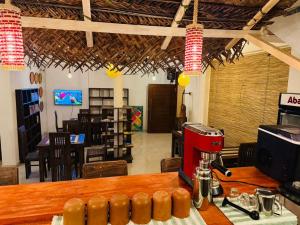a restaurant with a table with a coffee maker on it at The Lotus House - Ahangama in Ahangama