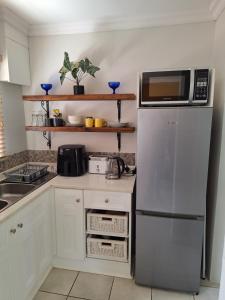 Kuchyň nebo kuchyňský kout v ubytování The Hilton Stay Cottages