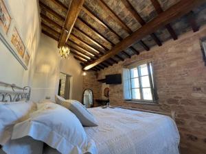 Postel nebo postele na pokoji v ubytování Dimora dei Lustri