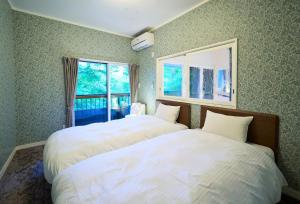 Ένα ή περισσότερα κρεβάτια σε δωμάτιο στο Suite Villa Hakone Sengokubara Kunsthaus +32 φωτογραφίες
