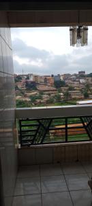 a view of a city from a window in a building at Felydac Hotel in Yaoundé