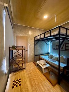 a room with two bunk beds and a ladder at LoftVibes San Juan - 4 in San Juan