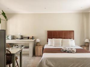 Ένα ή περισσότερα κρεβάτια σε δωμάτιο στο Villa Vredenrust Guesthouse