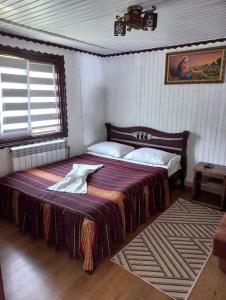 Postel nebo postele na pokoji v ubytování Котедж Лісова тиша