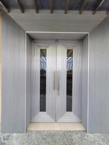 a door in the side of a building at Hotlel Sanjivani Salasar in Juliāsar