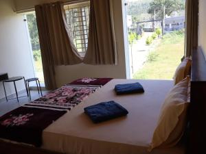 Ένα ή περισσότερα κρεβάτια σε δωμάτιο στο Drizzle Home - A Cosy Stay