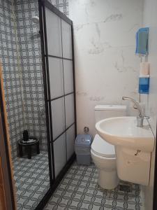 a bathroom with a sink and a toilet and a shower at Derin park otel in Sanlıurfa
