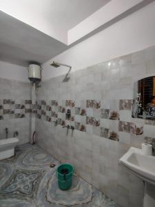 Koupelna v ubytování Kashi Home Stay