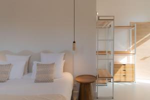 Ένα ή περισσότερα κρεβάτια σε δωμάτιο στο Coeur Cristal - Maison de maître & Ecolodge avec piscine et jardin