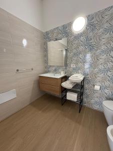 a bathroom with a sink and a mirror at Dreams29 in Cosenza