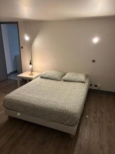 Postel nebo postele na pokoji v ubytování Le Nid du Sablard + 5 fotografií