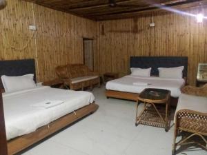 Postel nebo postele na pokoji v ubytování Spot on Naro Eco Resort