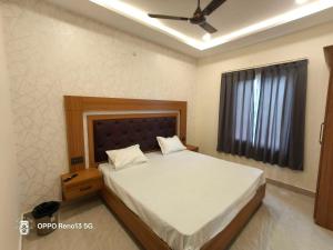 Giường trong phòng chung tại Hotel O NEW CLARK INN & BANQUET