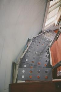 a metal staircase in a room with a ceiling at Converted Grain Silo for Unique Glamping Accommodation in Alvin, Illinois in Alvin