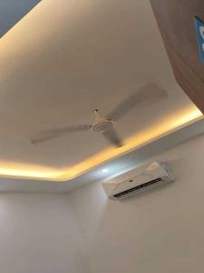 a ceiling with a light in a room at Hotel O Lavish Hotel in Greater Noida