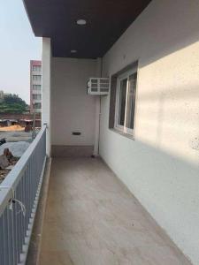 a balcony of a building with a air conditioner at Hotel O Lavish Hotel in Greater Noida +2 photos