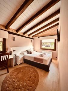 a bedroom with a large bed in a room with wooden ceilings at La Quinta Luxury Palace in Arnuero