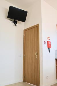 TV a/nebo společenská místnost v ubytování Domingos House