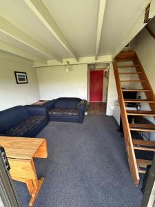 Ένα ή περισσότερα κρεβάτια σε δωμάτιο στο Ski Chalet Ohakune Alpine Village