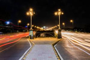 a city street with street lights at night at HOTEL SUN town in Ahmedabad +9 photos