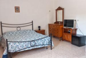 Postel nebo postele na pokoji v ubytování B&B Il Cortile del Sole